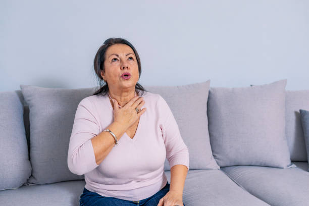 istock Senior woman at home feeling unwell 1095252816