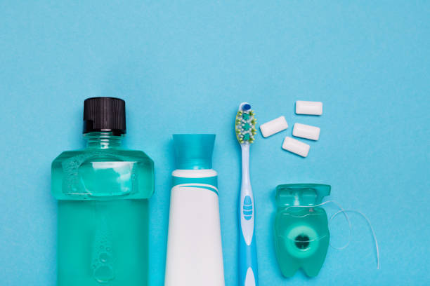 istock Tools for dental care: orthodontic brush, floss, toothpaste. Invisible dental aligners modern tooth brackets transparent braces to straighten teeth in cosmetic dentistry and orthodontics 1095254620