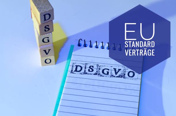 Block and blocks labeled DSGVO EU (DSGVO, EU Standardverträge) in English GDPR (General Data Protection Regulation, data protection commissioner) for the introduction of the DSGVO in the EU on 25.05.2018 bloque und bauklötze mit der aufschrift dsgvo eu(datenschutzgrundverordnung und eu standardverträge) en espanol gdpr (reglamento de protección de datos general, comisionado de protección de datos) zur einführung der dsgvo en der eu soy 25.05.2018