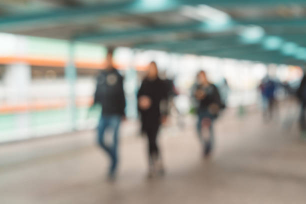 Defocused People Walking in modern hallway