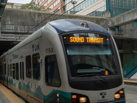 Seattle, WA AUGUST 26, 2018: Sound Transit Link light rail pulling into outdoor station