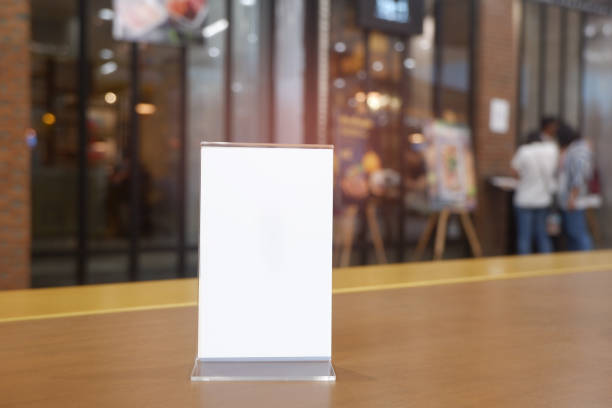 istock Menu frame standing on wood table in Bar restaurant cafe. space for text marketing promotion - Image 1095278700