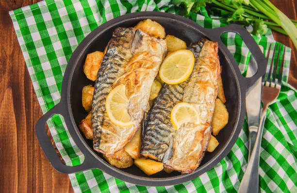 istock baked fish mackerel and potatoes. Selective focus. 1095278770