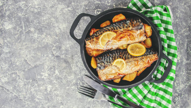 istock baked fish mackerel and potatoes. Selective focus. 1095278844