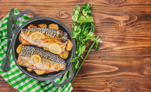 istock baked fish mackerel and potatoes. Selective focus. 1095278848