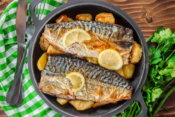 istock baked fish mackerel and potatoes. Selective focus. 1095278854