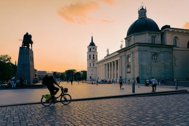 Vilnius, Lithuania - August 2, 2018: Man on bicycle at Cathedral square in the Old town in Vilnius in Lithuania.