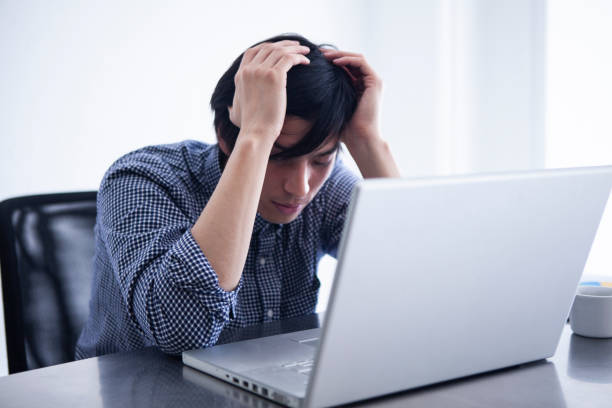 istock Male employees troubled with their heads 1095285222