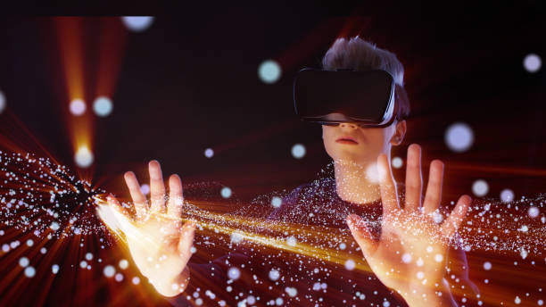 Man exploring virtual reality. VR headset. Cosmic dust Young man wearing VR headset. Discovering magical sparks of cosmic dust. virtual reality point of view photos stock pictures, royalty-free photos & images