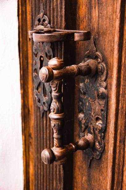 istock Old door handle on a wooden door 1095286858