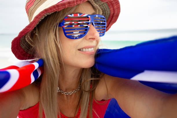 aussie woman supporter or australia day pride celebration - australia australia day celebration flag imagens e fotografias de stock