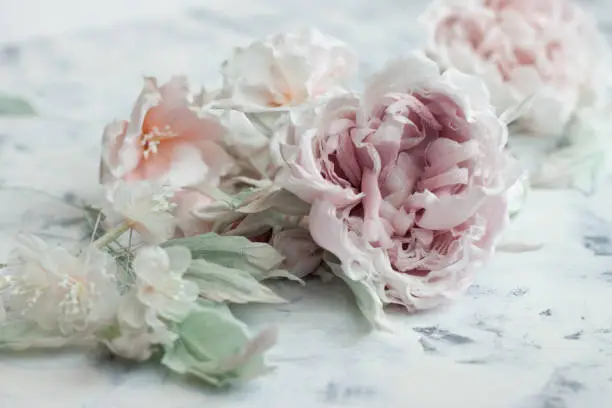 Photo of Silk flower backgroung. Handmade fabric rose flowers.