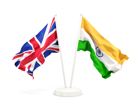 Two waving flags of UK and india isolated on white. 3D illustration