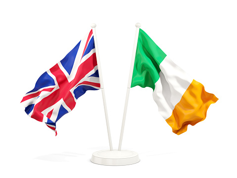 Two waving flags of UK and ireland isolated on white. 3D illustration