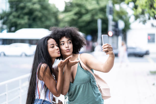 istock Girlfriends taking selfie and blowing a kiss 1095302066