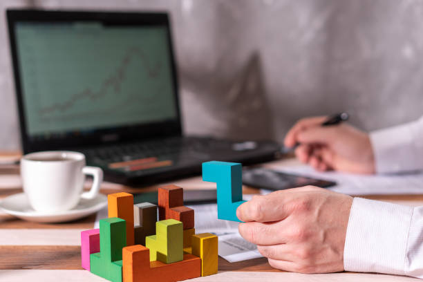 istock Businessman with conundrum at table in office. 1095303144