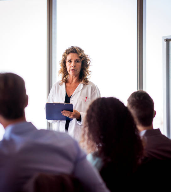 istock Confident doctor giving presentation in meeting 1095309870