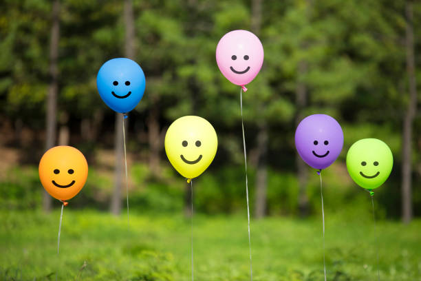 istock colored balloons floating in the forest. 1095312788
