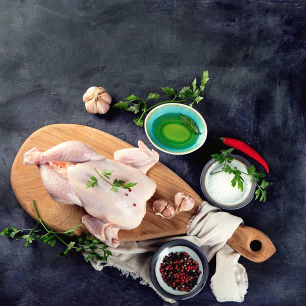 istock Whole raw chicken with seasonings 1095315772