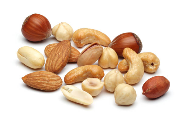 Mixed nuts Mixed nuts isolated on white background nut variation healthy lifestyle pistachio stock pictures, royalty-free photos & images