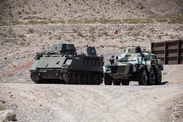 Photo of Tank and armoured vehicle stationed in the desert