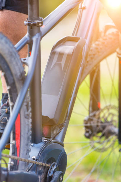 istock Low Section Of Man Riding Bicycle At Park 1095321278