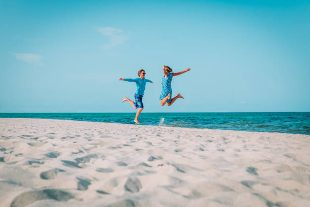 istock Happy loving couple enjoy tropical beach vacation 1095322614
