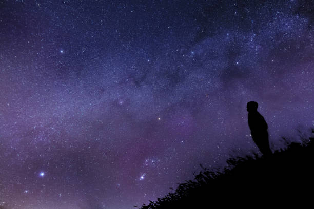 istock Silhouette of a lonely man watching the Milky Way 1095325144