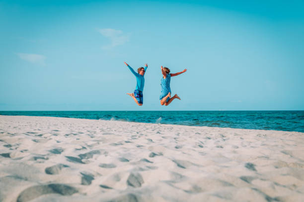 istock Happy loving couple enjoy tropical beach vacation 1095328636