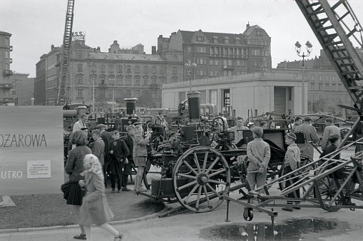 Warsaw, Poland, 1957. Exhibition of old and new Läsch equipment and vehicles on a Warsaw square. Furthermore: visitors, interested people, locals and teenagers.