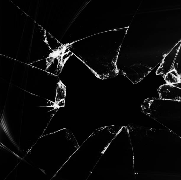istock Shattered and broken glass on a dark background 1095333034
