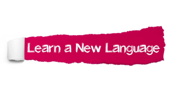 istock Learn a New Language text, Inspiration, Motivation and Business concept on Red torn paper 1095338870