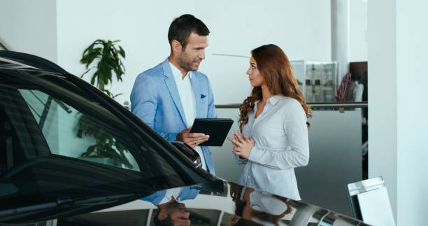 istock Car salesman with a customer 1095345108