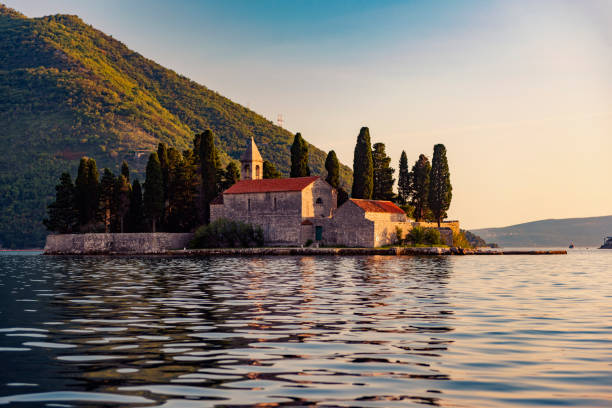 Bay of Kotor – UNESCO World Heritage Site, Our Lady of the Rocks Church Bay of Kotor, Montenegro at sunset – UNESCO World Heritage Site montenegro stock pictures, royalty-free photos & images