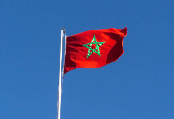 Real flag of morocco on blue sky background