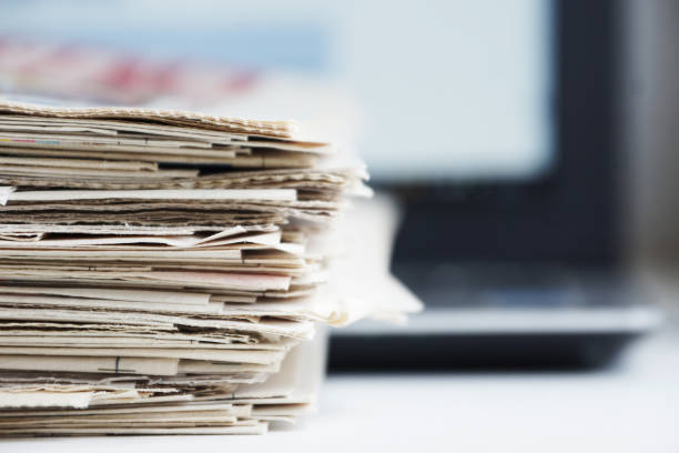 istock Newspapers and Laptop 1095347686