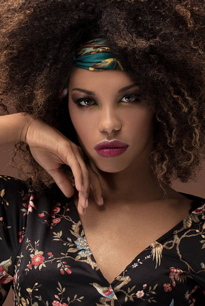 istock Stylish afro girl posing in studio. 1095347800