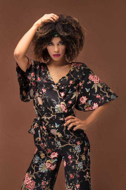 istock Stylish afro girl posing in studio. 1095347992