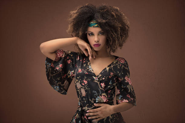 Stylish afro girl posing in studio.