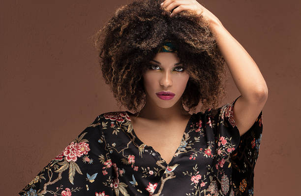 istock Stylish afro girl posing in studio. 1095348316