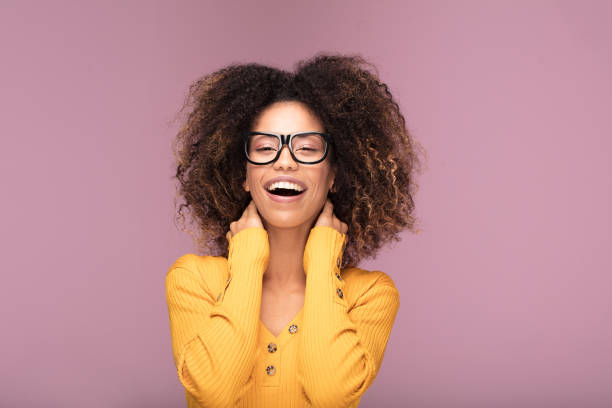 istock Young afro woman wearing eyeglasses, smiling. 1095352820