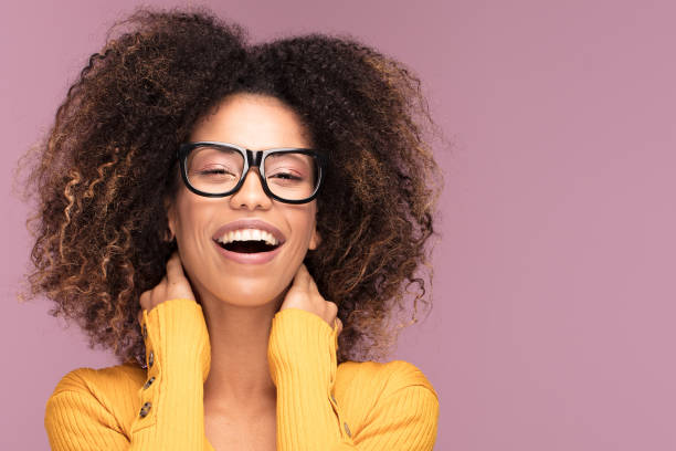 istock Young afro woman wearing eyeglasses, smiling. 1095352942