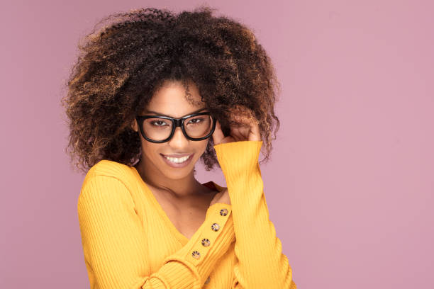 istock Young afro woman wearing eyeglasses, smiling. 1095353342