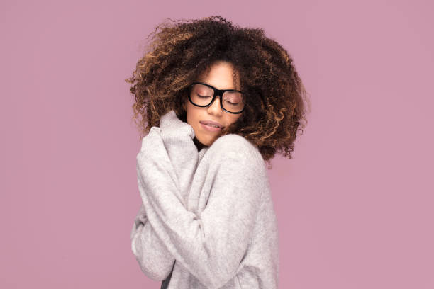 istock Young girl with an afro wearing eyeglasses. 1095353378