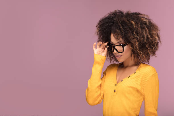 istock Young afro woman wearing eyeglasses, smiling. 1095353896