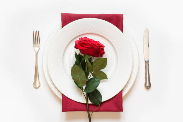 istock Valentine's day dinner. Romantic table setting with red rose. View from above. 1095358786