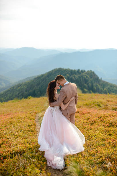 Young love couple celebrating a wedding in the mountains stock photo
