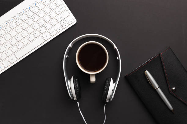 istock Business desk background banner.  Note pad, computer keyboard and coffee. Top view 1095360972
