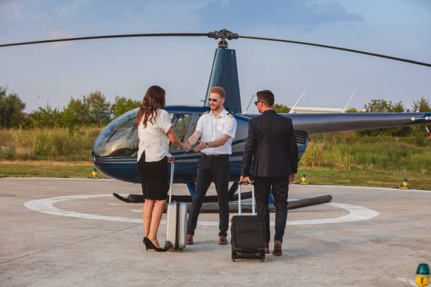 istock Warm welcome for passengers couple by helicopter pilot 1095363702