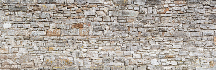 Viejo muro de piedra natural gris photo
